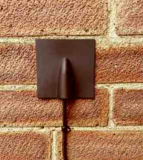 A professional installer will use a brick 'burst' plate. It looks better than damaged brickwork